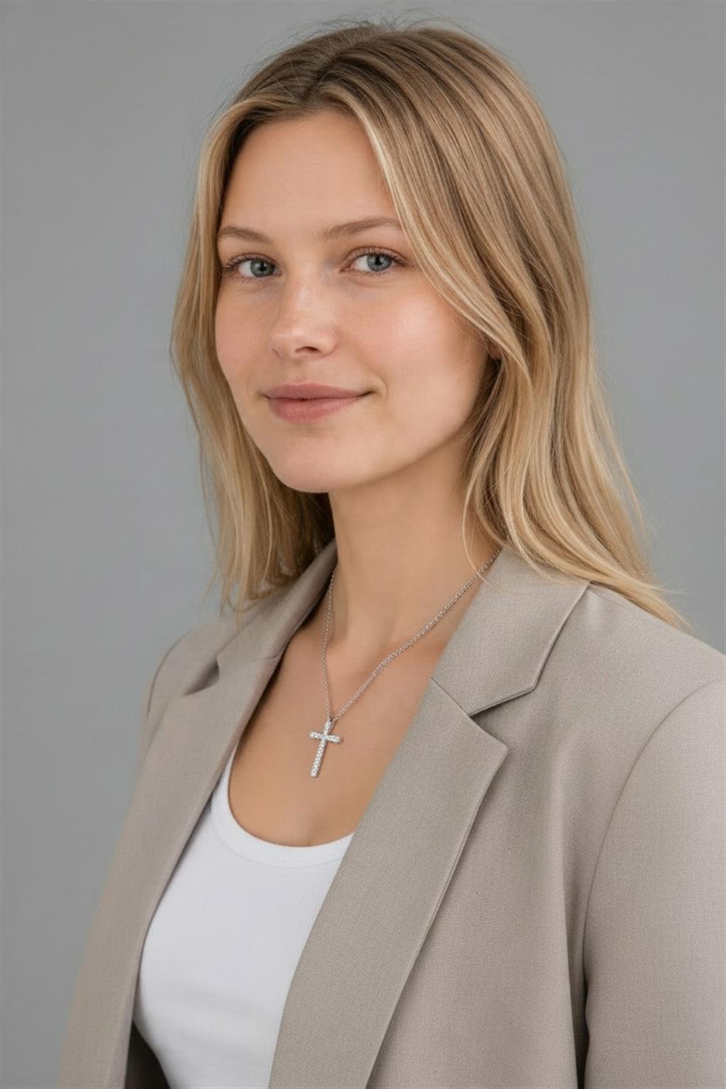 A women wearing a White Gold 0.50ct Diamond Cross Pendant Necklace