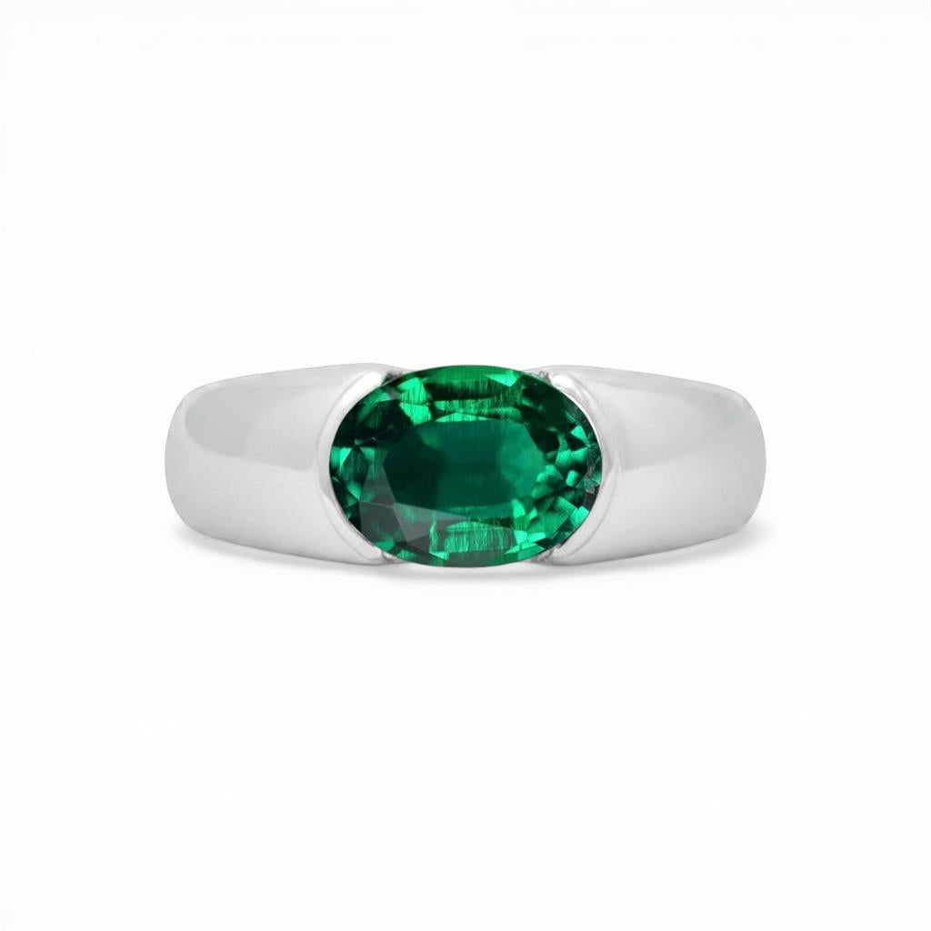 Platinum Oval Emerald Ring with Hidden Diamond Detail