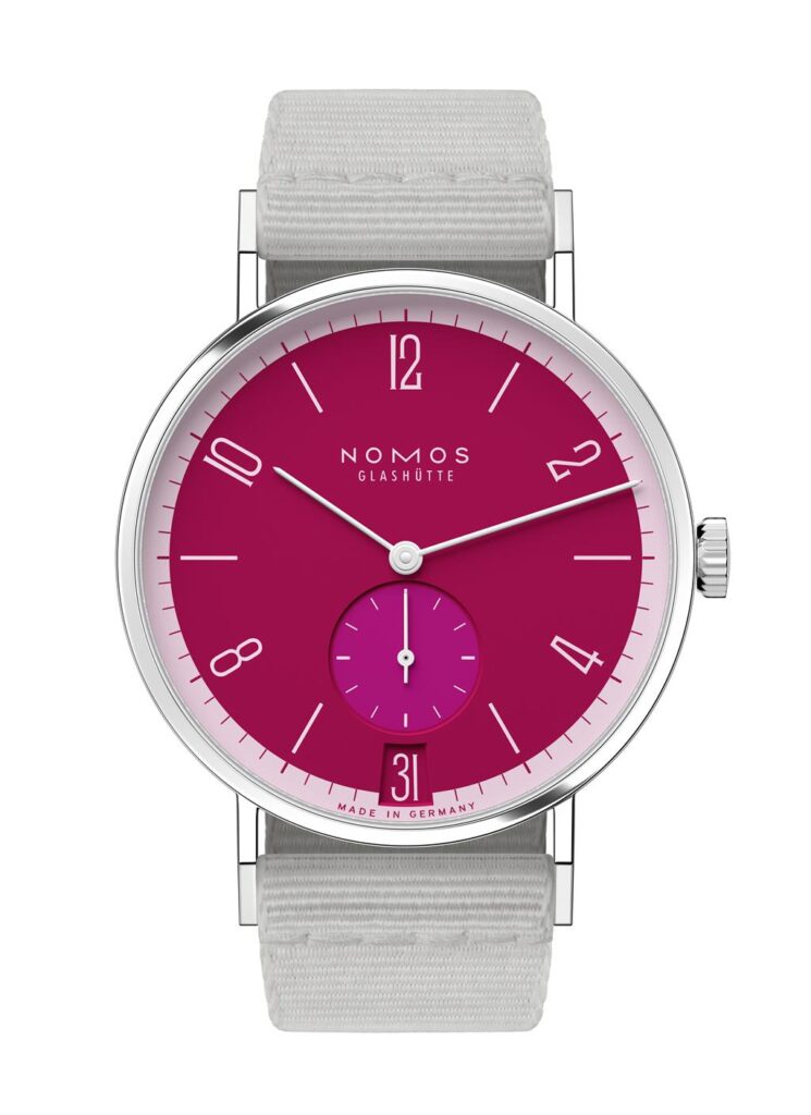 Stylish NOMOS Glashütte watch with a vibrant magenta dial and sleek stainless steel case.