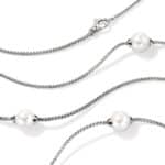 Elegant silver woven necklace with lustrous pearls, perfect for chic everyday wear or special occasions.