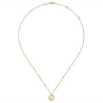 Elegant gold necklace with a textured cross pendant, perfect for everyday wear and layering.