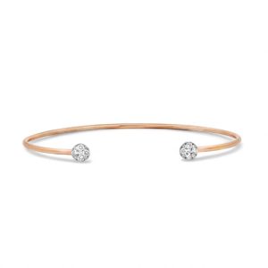 Elegant rose gold cuff bracelet with sparkling stone embellishments for minimalist style.
